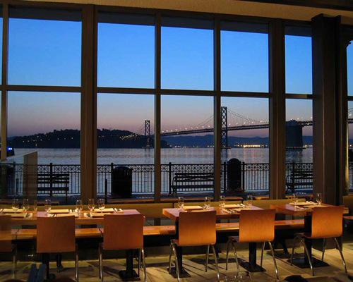 Multiple scales show in Olle Lundberg's interior for the Slanted Door, which also makes use of industrial structures such the Bay Bridge seen in the far distance. Photo: Ryan Hughes