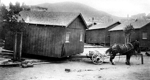 The original San Francisco "earthquake cottages" were mass-produced in the early 1900s, designed for transportability, and could be considered as the original Tiny Houses - although they're not quite as small.