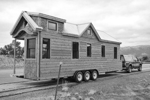Tiny Houses weigh in at the 10,000-12,000 lb range. They require a massive tow vehicle with special hauling equipment and driving skills. This example is from Rocky Mountain Houses. Photo: Greg Parham