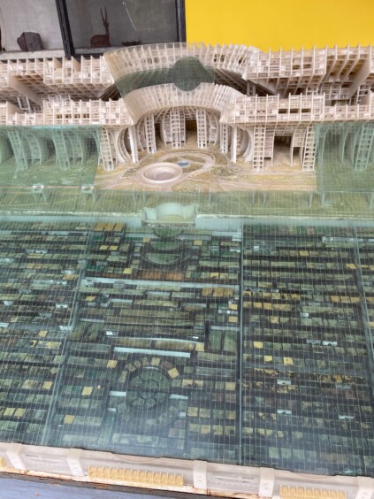 Architectural scale model showing dense futuristic city with multiple apse structures and towers