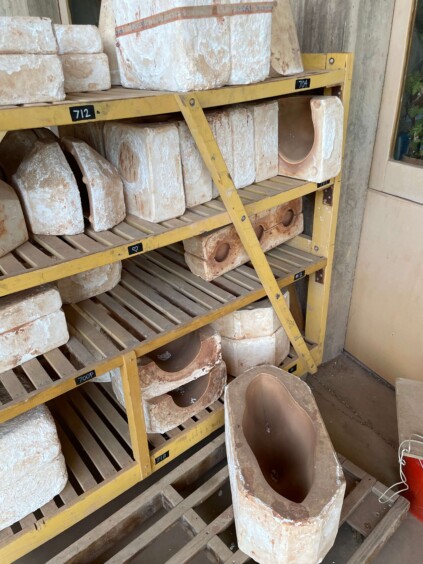 Plaster or clay molds in various shapes used for casting ceramic bells