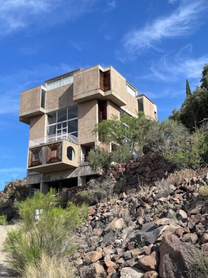 Main administrative building at Arcosanti with distinctive curved concrete forms and earth-toned walls